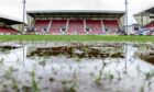 Sodden: The East End Park surface on Friday afternoon