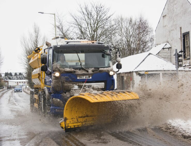 A snowplough keeps the roads open in Couper Angus