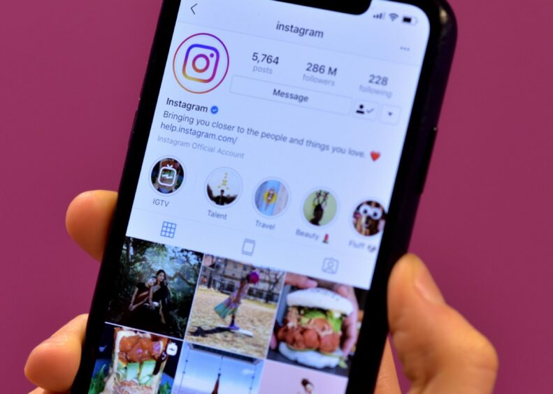 A phone displaying the Instagram app