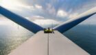 Engineer at top of offshore wind turbine in Scotland