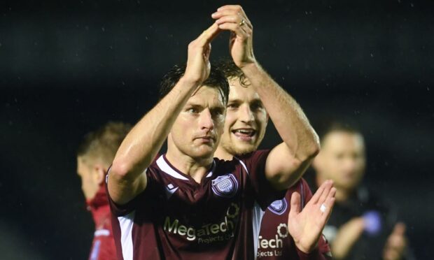 Arbroath players Michael McKenna, and Thomas O'Brien just over his shoulder, have both been nominated for PFA Championship player of the year.