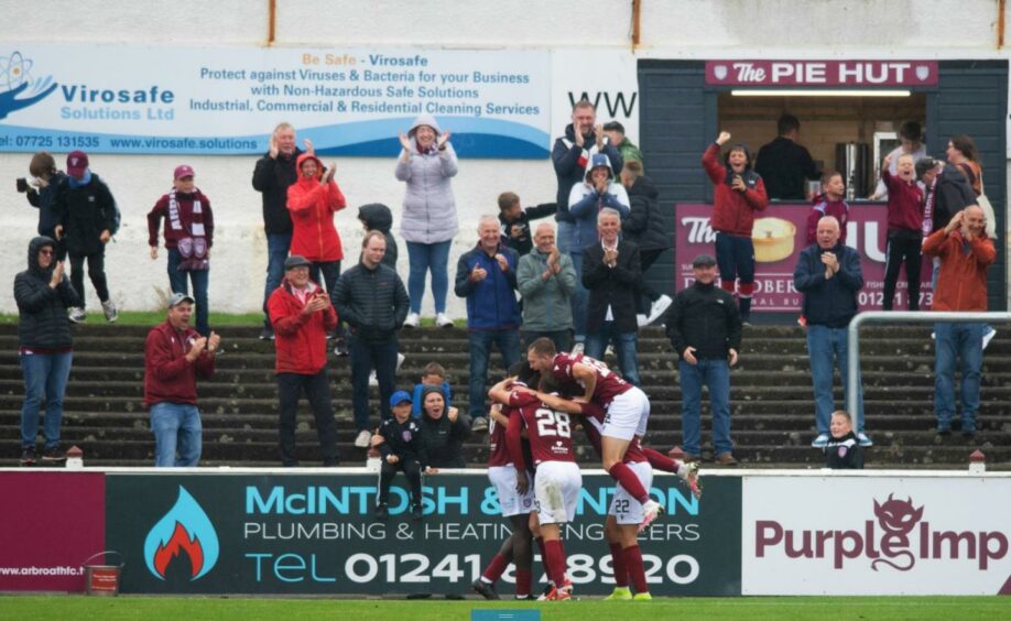 The Arbroath players and fans celebrate Michael McKenna's first goal against Partick at Gayfield last time round.