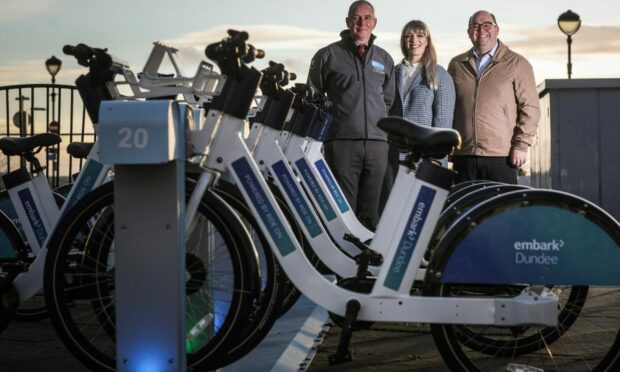 Brian Bellman, Dundee city's manager for Ride On, Sara Ylipoti chief operations officer of Ride On and Peter Docherty, CEO of Embark Platform with some of the e-bikes.