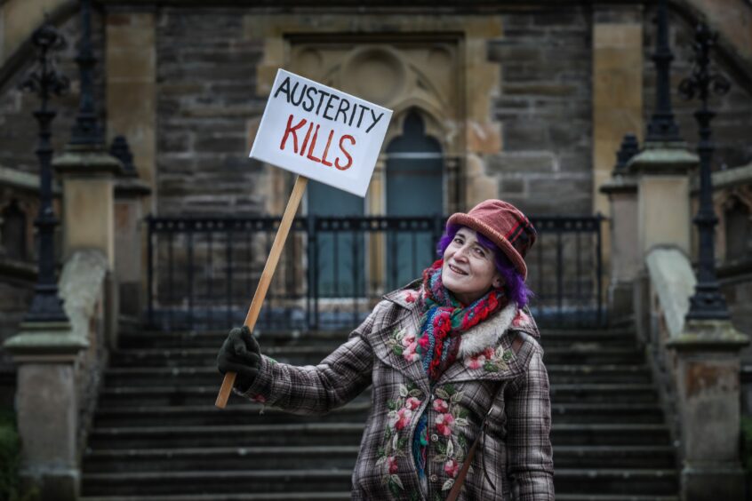 Valentine Scarlett attends a protest against the rising cost of living outside the McManus museum in Dundee earlier this month.