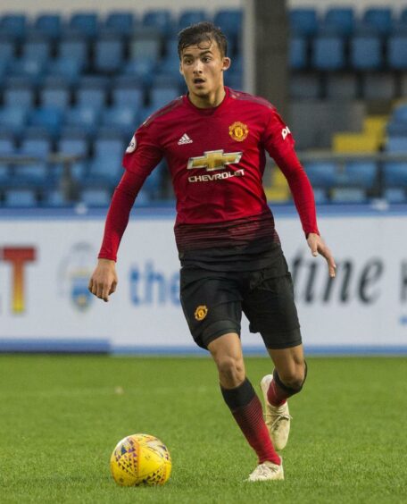 Tom Sang in action for Manchester United at Morton.