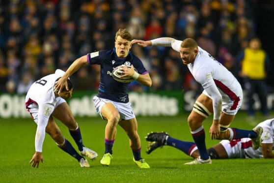 Darcy Graham splits the defence as Scotland score their first try.