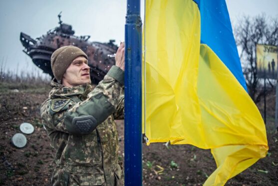 Ukrainian soldiers from the 93rd Cold Yar Brigade of the Ukraine Armed Forces raises Ukrainian national flag in the Russian-backed rebel held Donetsk frontline. Wednesday Feb 23, 2022.  Photo by EyePress News/Shutterstock