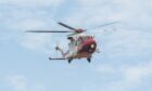 A coastguard helicopter airlifted the woman to hospital.