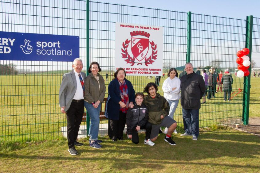 Ed Oswald and family members at the new community pitches. Pic: Paul Reid.