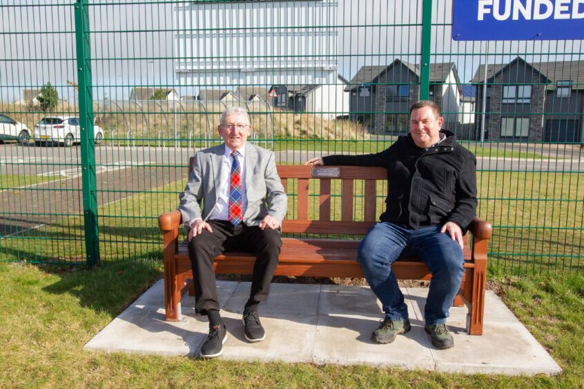 Ed Oswald and Phil Hope on a bench placed in Helen Oswald's honour. Pic: Paul Reid.