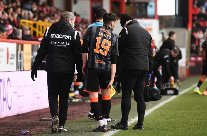 Dylan Levitt leaved the field at Pittodrie with the Dundee United medical staff.