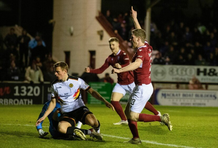 Colin Hamilton celebrates putting Arbroath in front.