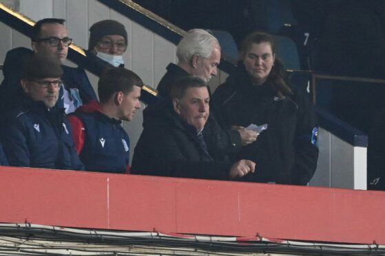 Dundee manager Mark McGhee watches on against Hibs.