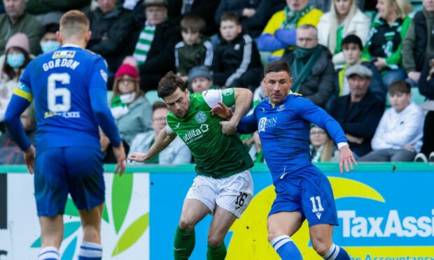 Liam Gordon watches as Michael O'Halloran and Lewis Stevenson compete for the ball.