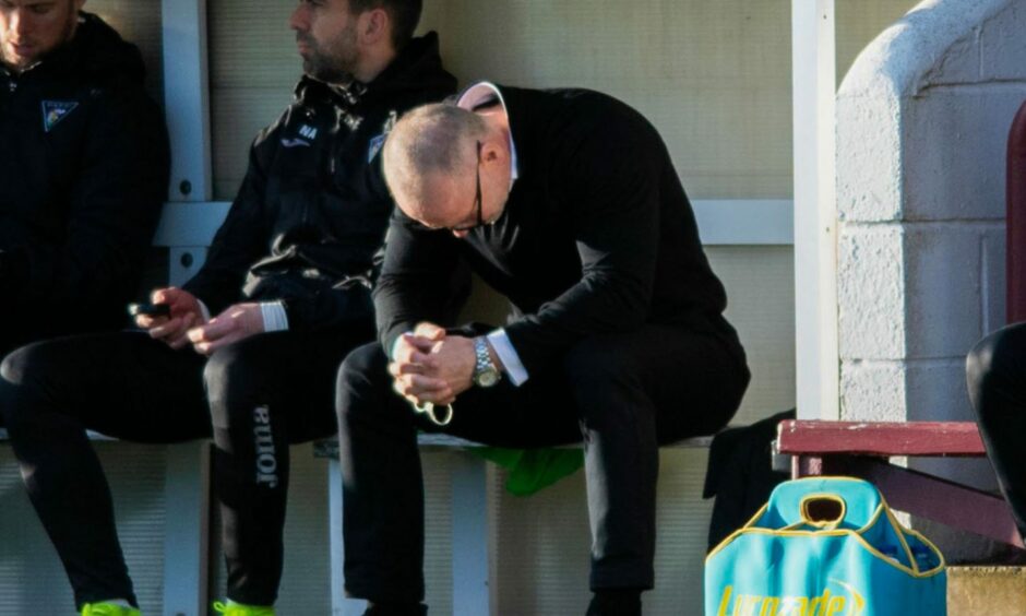 John Hughes can hardly believe it as his side went down 1-0 to Arbroath.