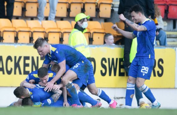 St Johnstone players pile on top of Callum Hendry after his Goal of the Season-nominated strike.