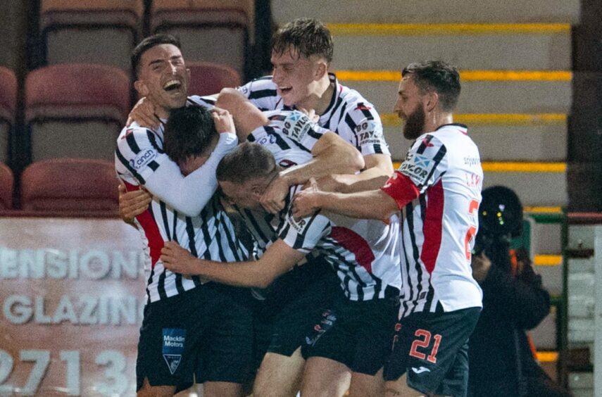 Josh Edwards celebrates with his Dunfermline teammates during the 4-1 win over Partick Thistle.