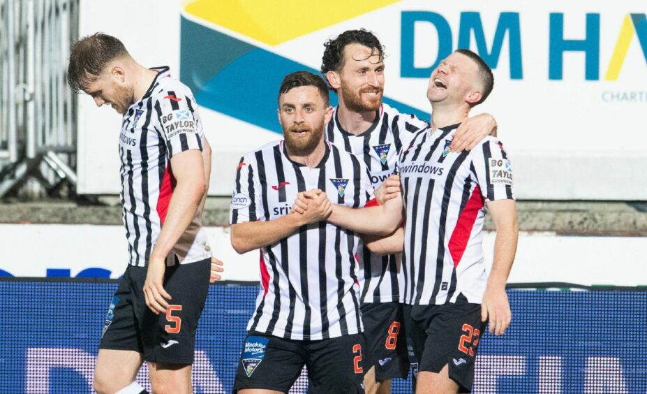 Dom Thomas is congratulated after making it 4-1 Dunfermline.
