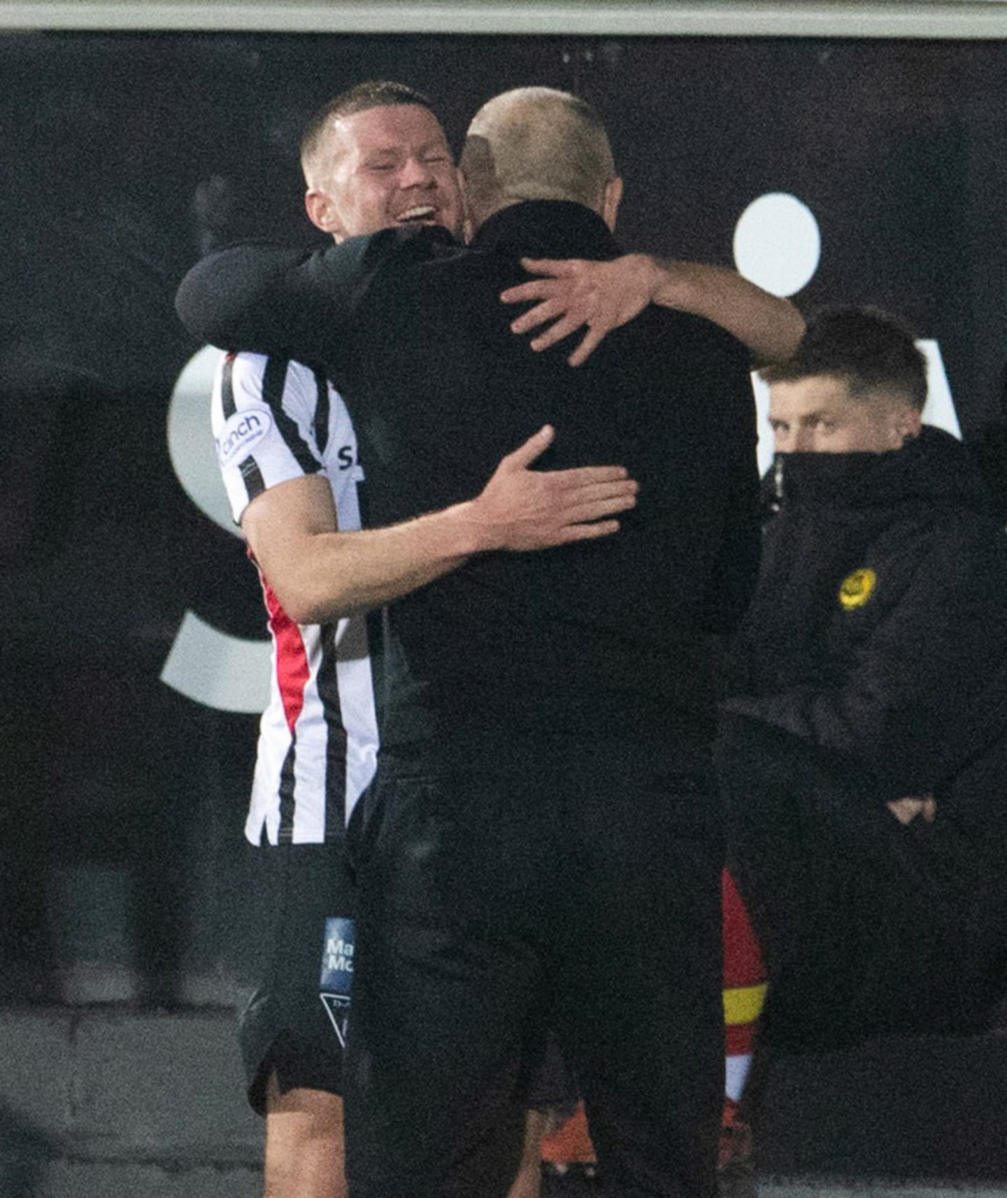 Dom Thomas is embraced by John Hughes after his goal.