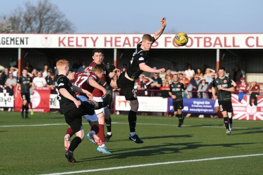 Max Kucheriavyi scores the goal that secured the title for Kelty Hearts.
