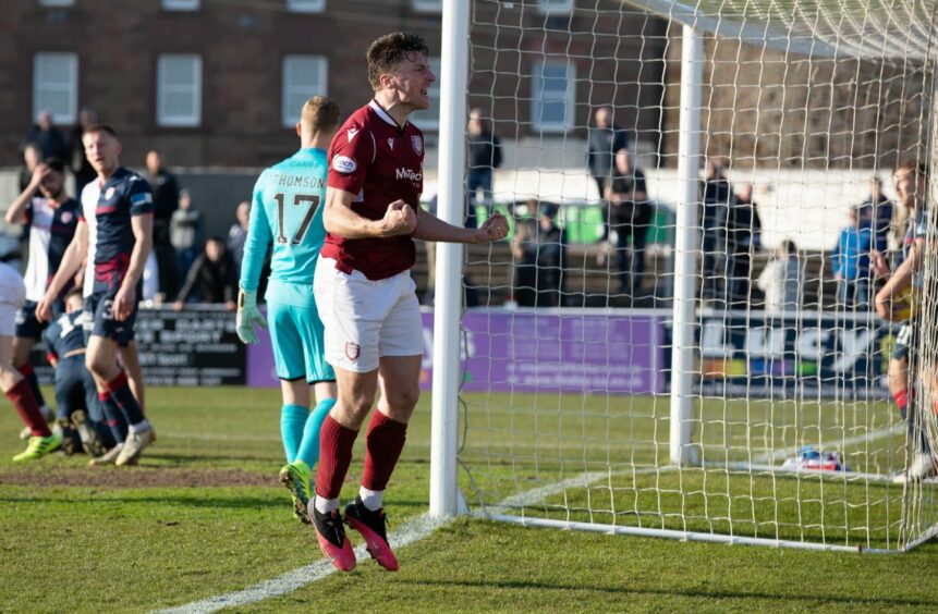 Michael McKenna celebrates after completing Arbroath's come back against Raith Rovers.