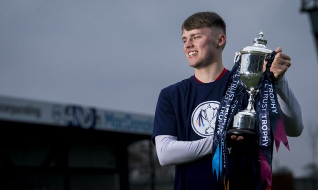 Ethan Ross with the SPFL Trust Trophy.