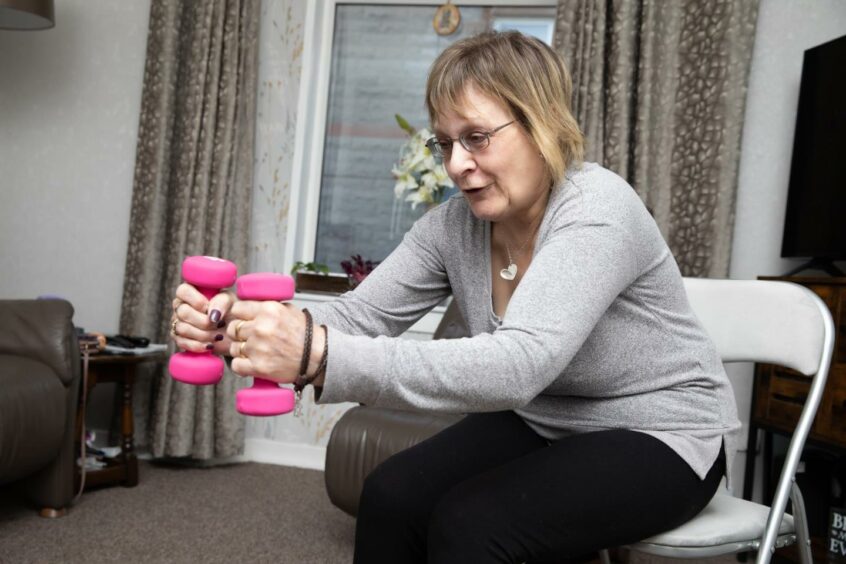Bev does online fitness classes to help manage her MS