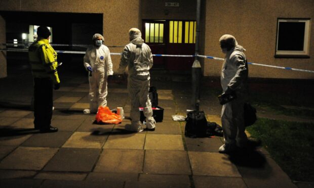 Officers in forensics suits at Touch in Dunfermline. Credit: David Wardle.