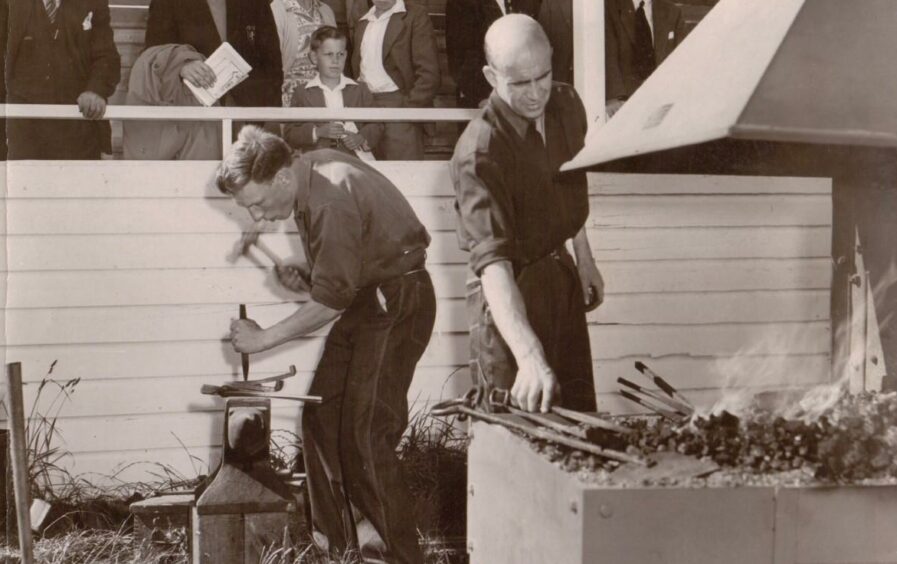 David Wilson BEM pictured at the anvil in action with fellow farrier Jock Mackenzie.