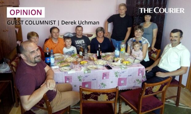 Derek and his Ukrainian family at a gathering in their home village of Szybalyn.