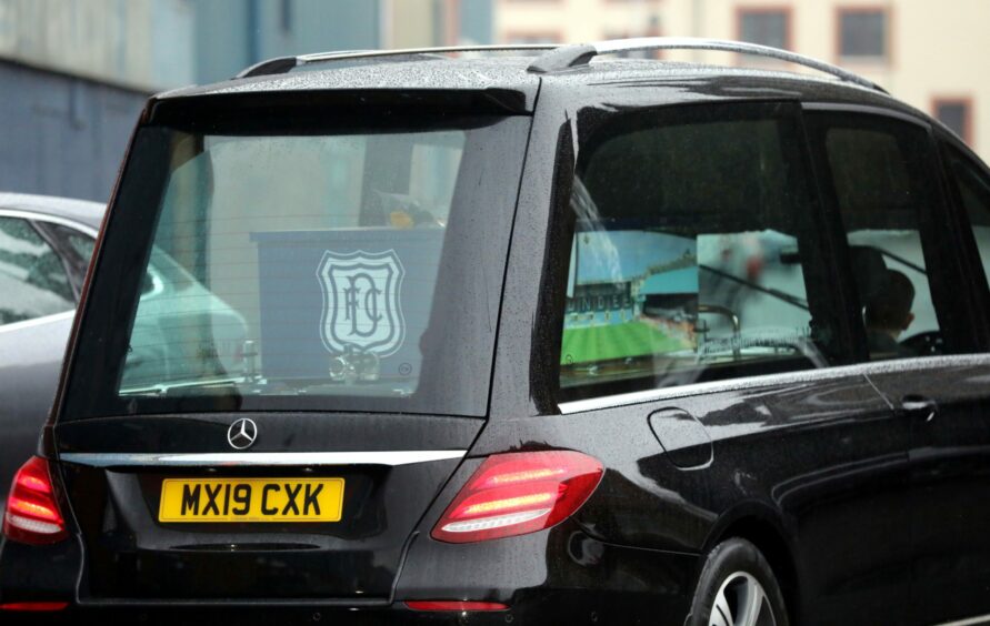 Just as she wanted it: Petra's casket covered in Dundee FC imagery.