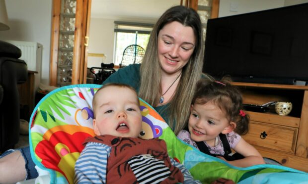 Asher with mum Ruth and his sister Elodie, three.