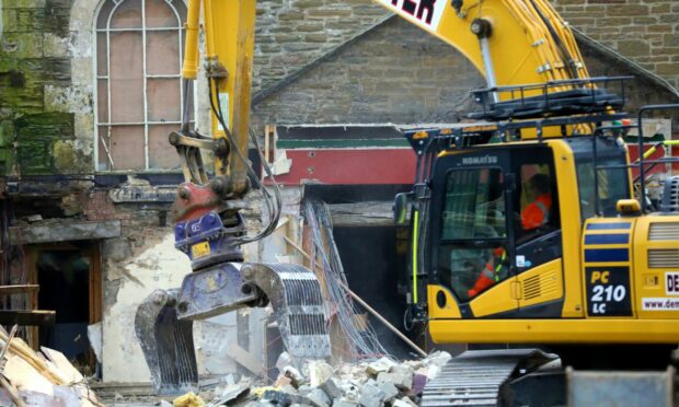 Bulldozers have begun tearing down the old Cambustay Hotel.