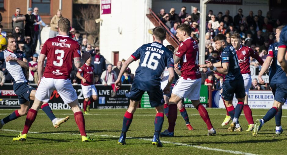 Jack Hamilton fires through a crowded penalty to give Arbroath an early lead.