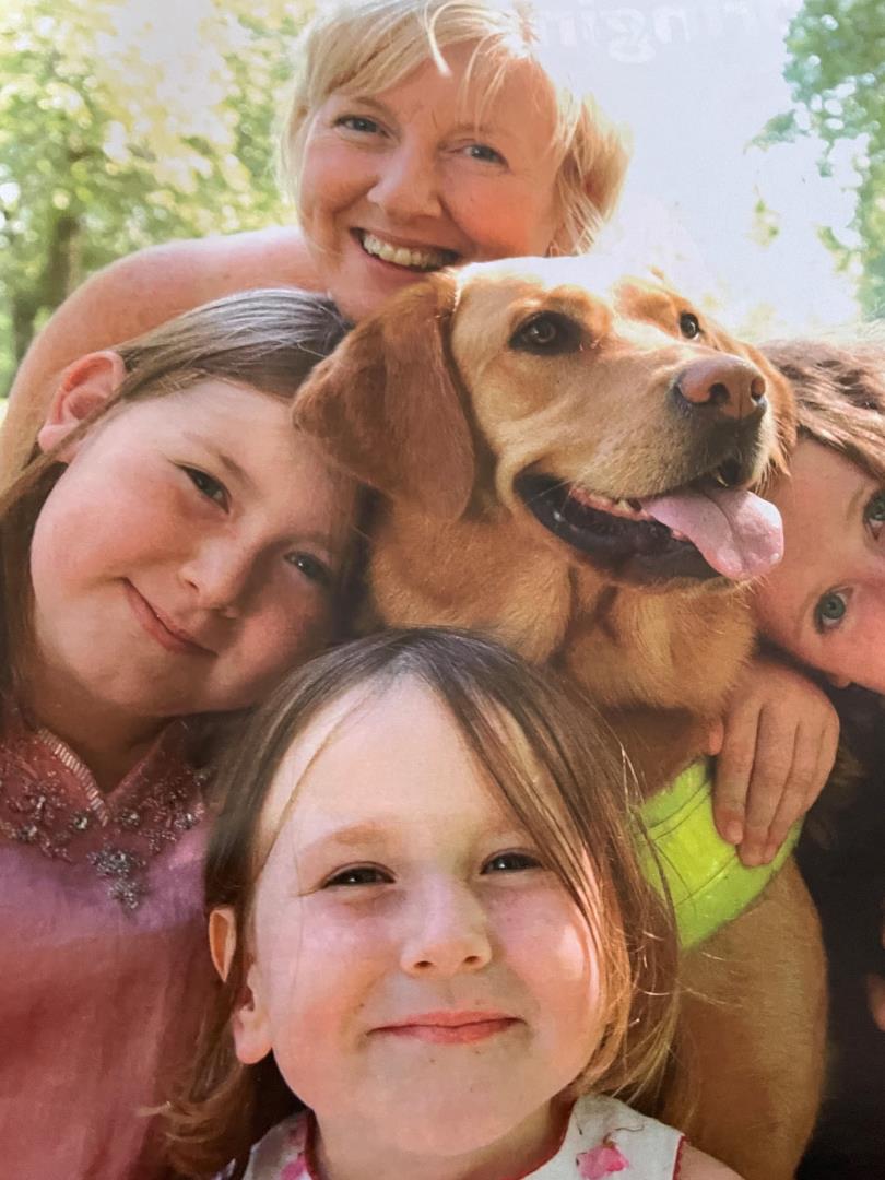 Mhairi with daughters Caroline, Catherine and Christina and Wanda the guide dog in 2004.