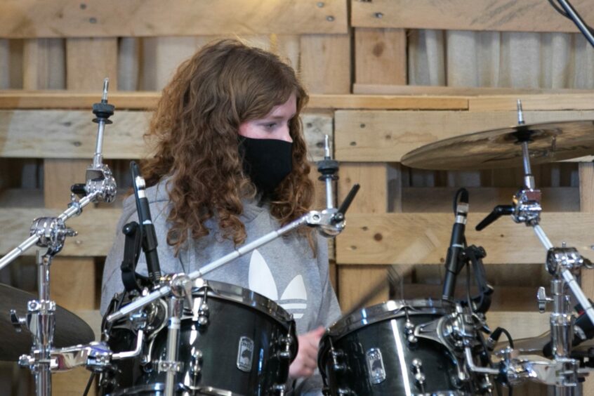 Perform in Perth pictures include Isla Burns from Perth High School on the drum kit