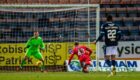 Connor Ronan scores a late header, beating Dundee's Harrison Sharp to win the game for St Mirren