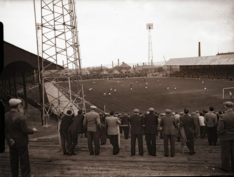 Supporters watching a game at Dens Park in 1960. Image: DC Thomson.