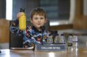 Callum Isted holds up his water bottle during Holyrood parliament talks