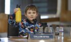 Callum Isted holds up his water bottle during Holyrood parliament talks