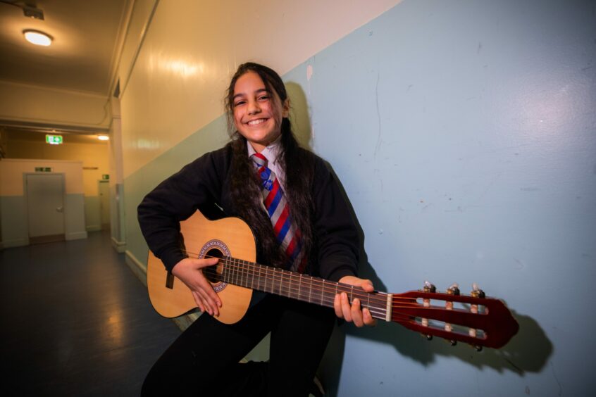 Guitarist Rayan at Dundee schools spring concert 2022