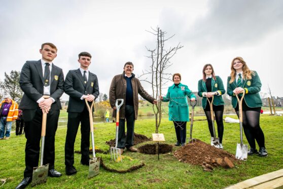 Rotary president John Rawlings and Angus Lord Lieutenant Pat Sawers with Shay McGivney and Finlay Tough (Arbroath Academy) and Kimberley Wann and Rachael Borland (Arbroath High). Pic: Steve Brown/ DCT Media.
