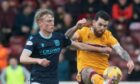 Max Anderson and Liam Donnelly battle for the ball as Dundee took on Motherwell.