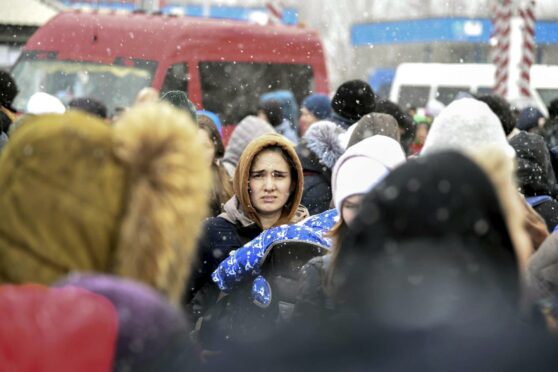 Ukrainian refugees cross into Moldova. How many will make it to Dundee and what will you do to help? Photo: Ciro Fusco/EPA-EFE/Shutterstock.