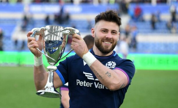 Man of the match Ali Price with the Cuttitta Cup.