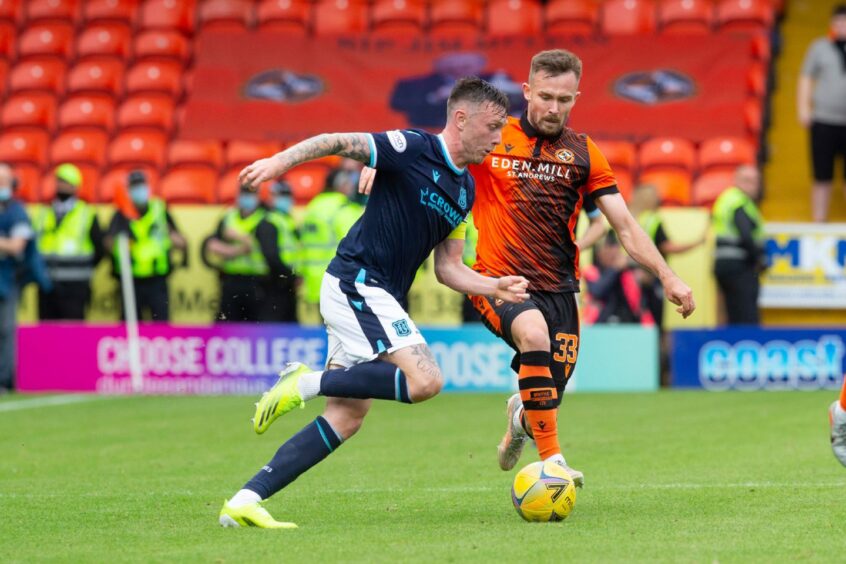 Jordan McGhee takes on Dundee United at Tannadice earlier this season.