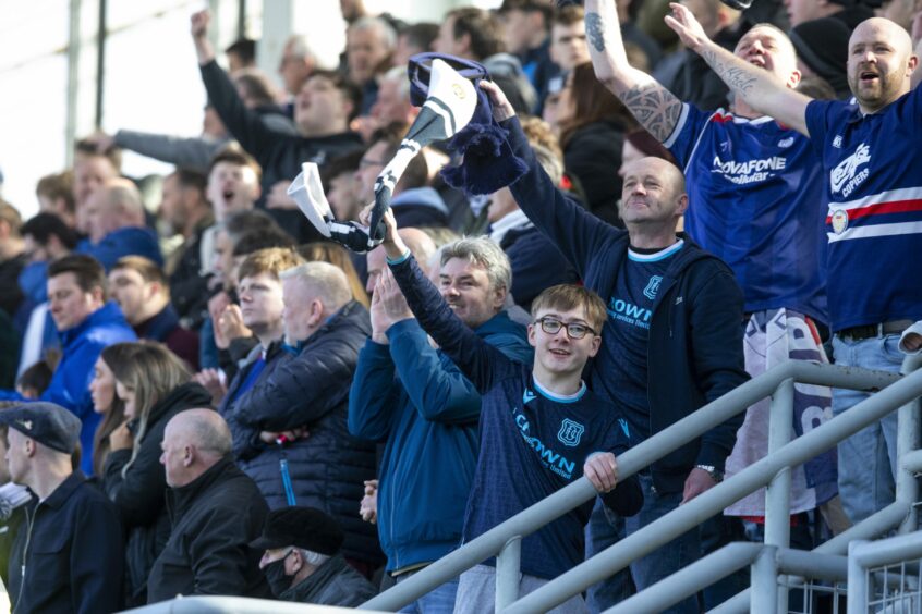 Dundee fans salute their side at Tannadice.