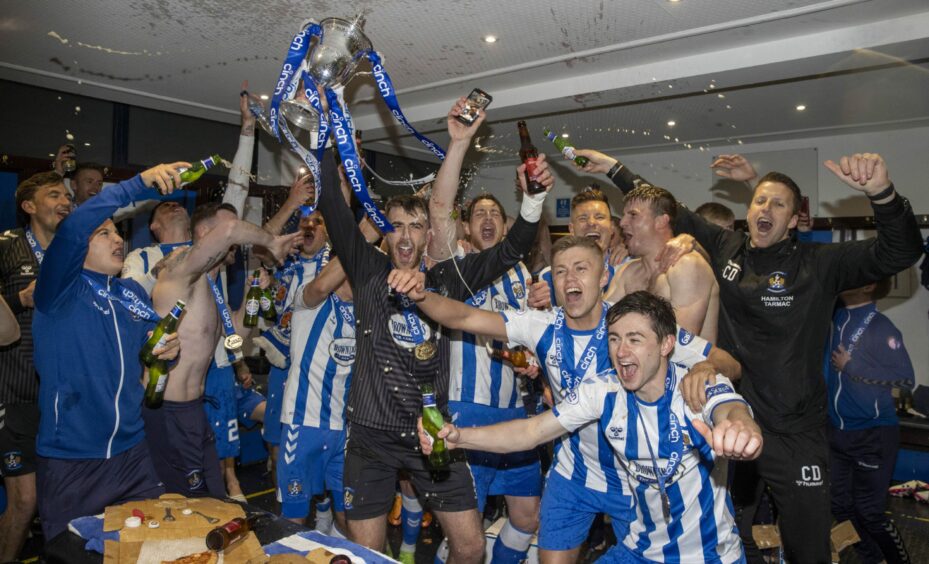 The Kilmarnock players celebrate their title victory.