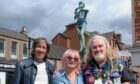 Bon Scott's son Dave Stevens (left) with Melbourne friends Mary Renshaw and Glenn Smith in Kirrie Square. Pic: Paul Reid.