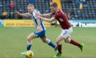 Arbroath's Colin Hamilton tussles with Chris Burke of Kilmarnock for the ball at Rugby Park last year.